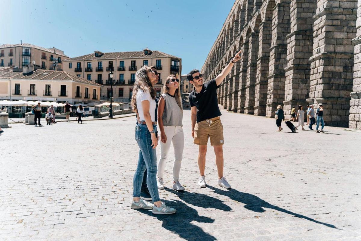 a group of people standing in front of a building