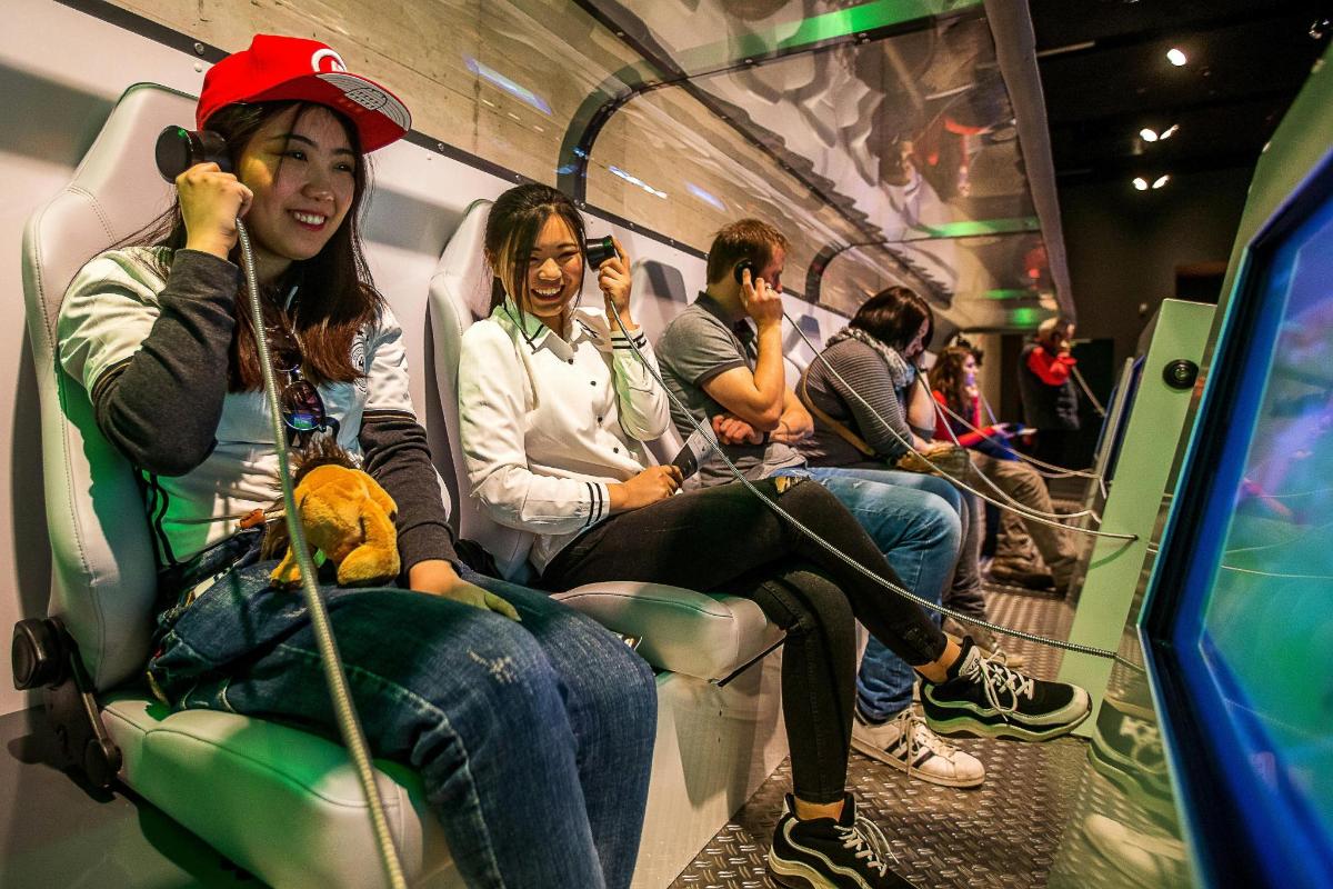 a group of people sitting on a subway train