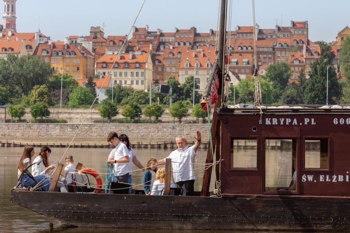 a group of people on a boat in the water