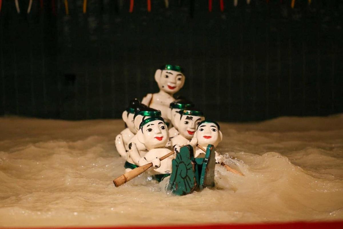 a group of toy figurines in a pool of water