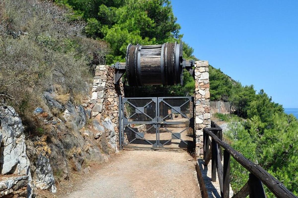a barrel on top of a gate on a mountain