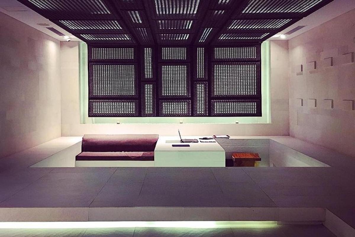 a room with a couch and a large window