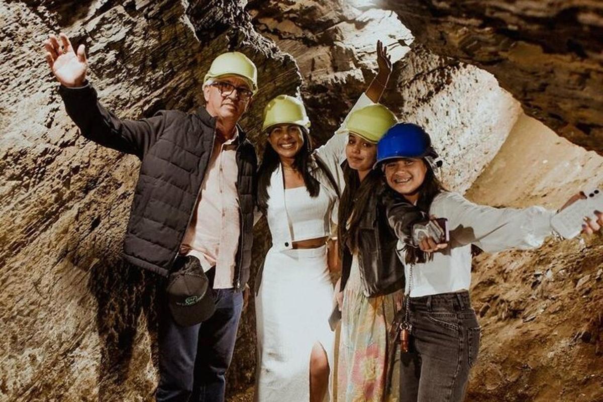 a group of people wearing hard hats posing for a picture