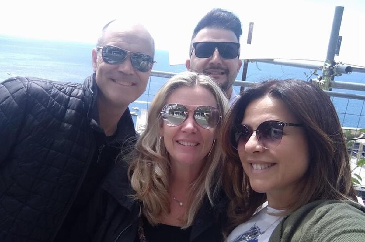 a group of three people posing for a picture
