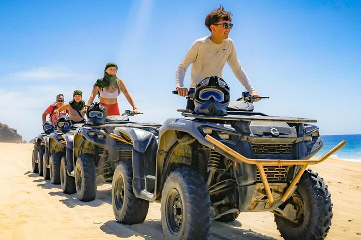 isang grupo ng mga taong nakasakay sa mga atv sa dalampasigan
