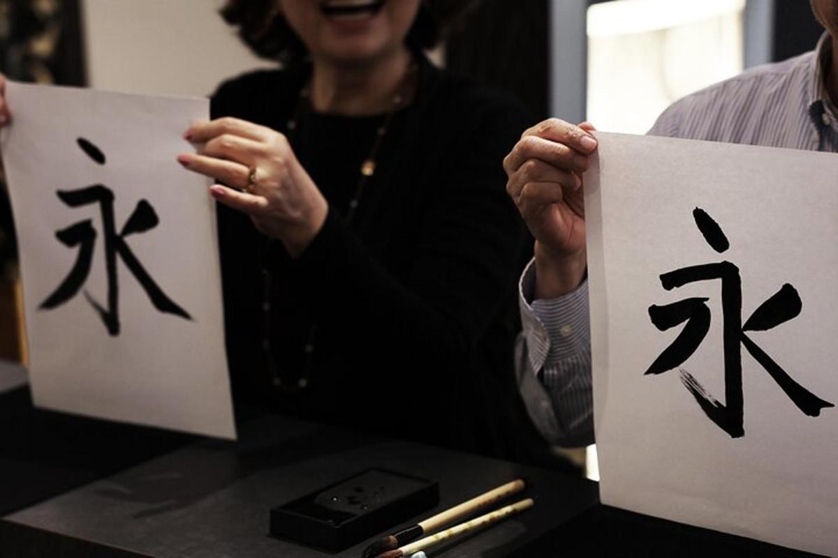 a woman holding up signs with chinese writing on them
