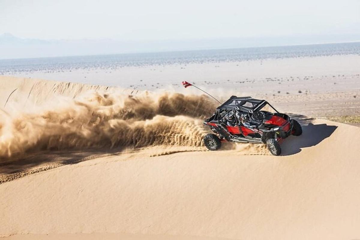 a atv driving on the sand in the desert