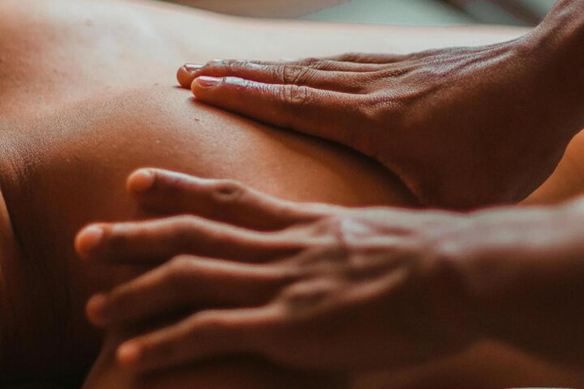 a person getting a back massage on a woman