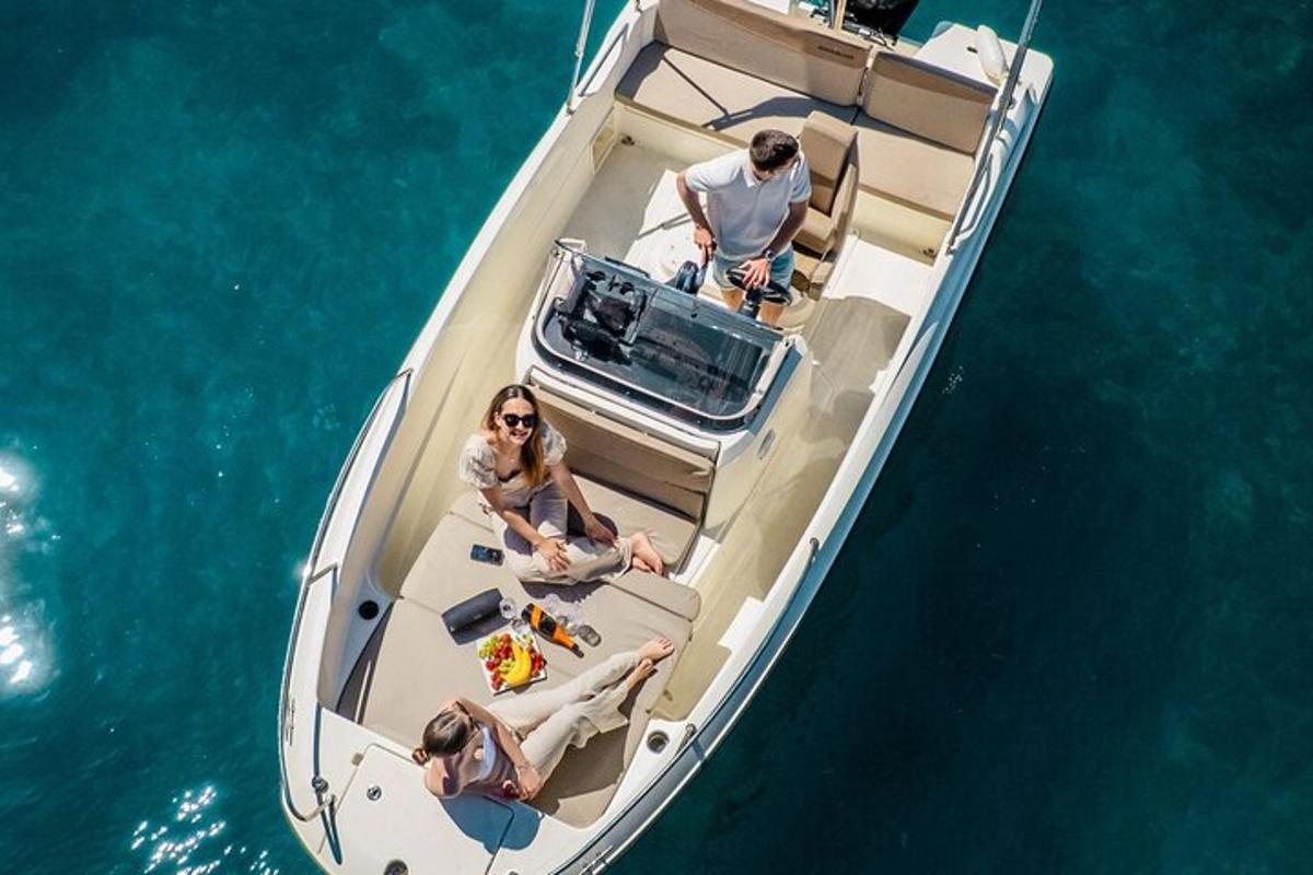 a group of people sitting on a boat in the water