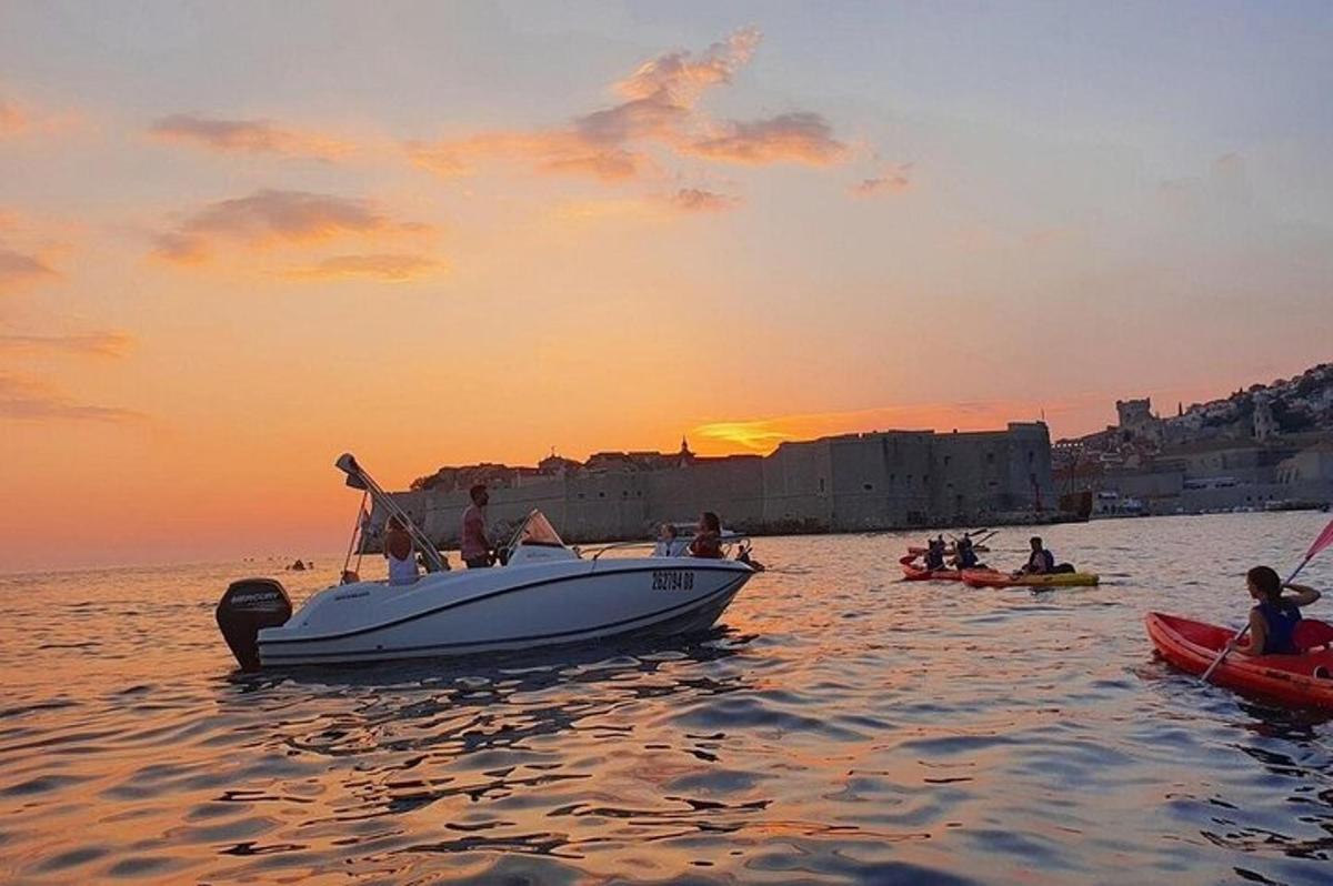 a group of people on a boat in the water