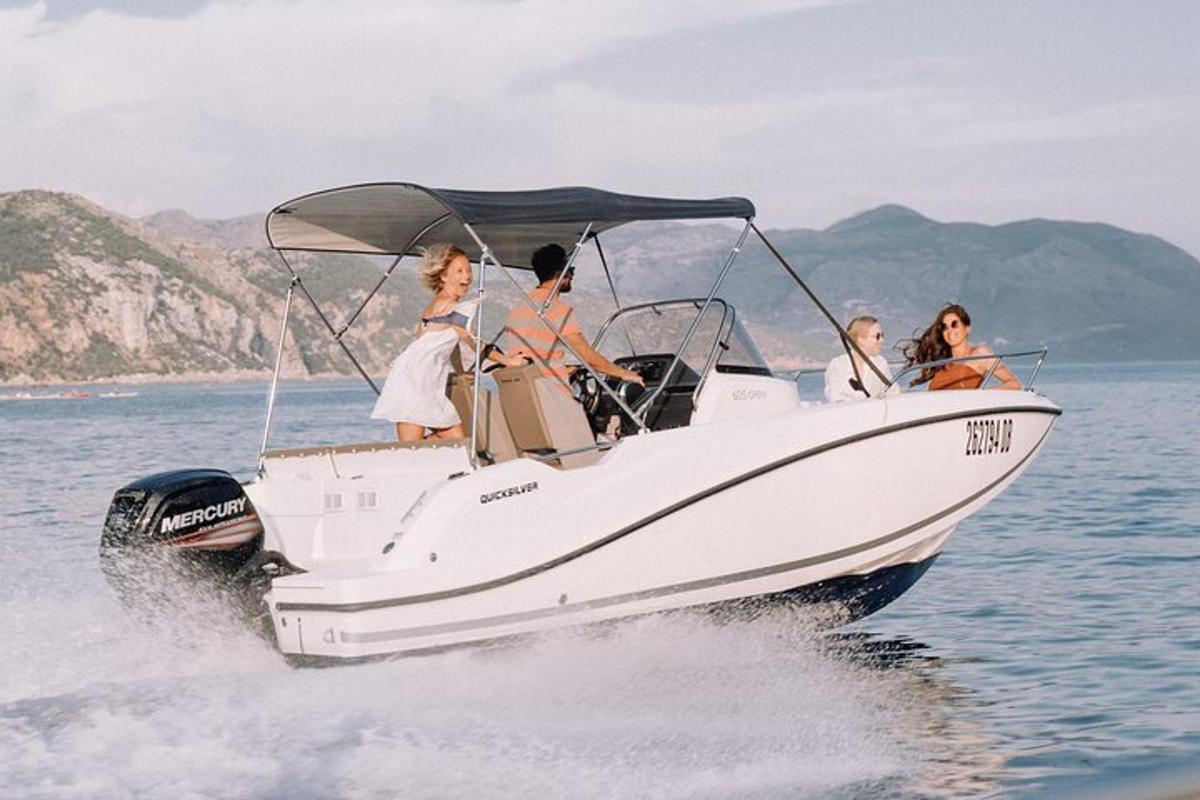 a group of people on a boat in the water