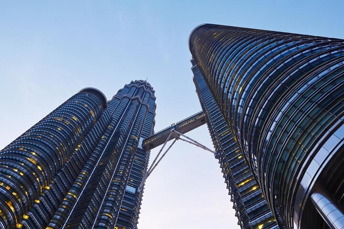 two tall buildings are standing next to each other