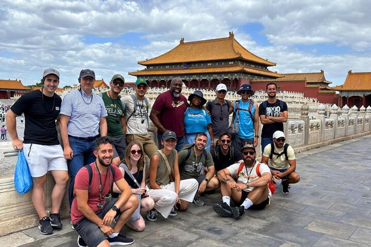 a group of people posing for a picture on a bridge