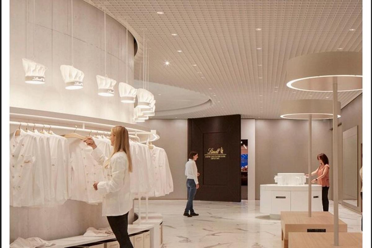a woman is looking at clothes in a store