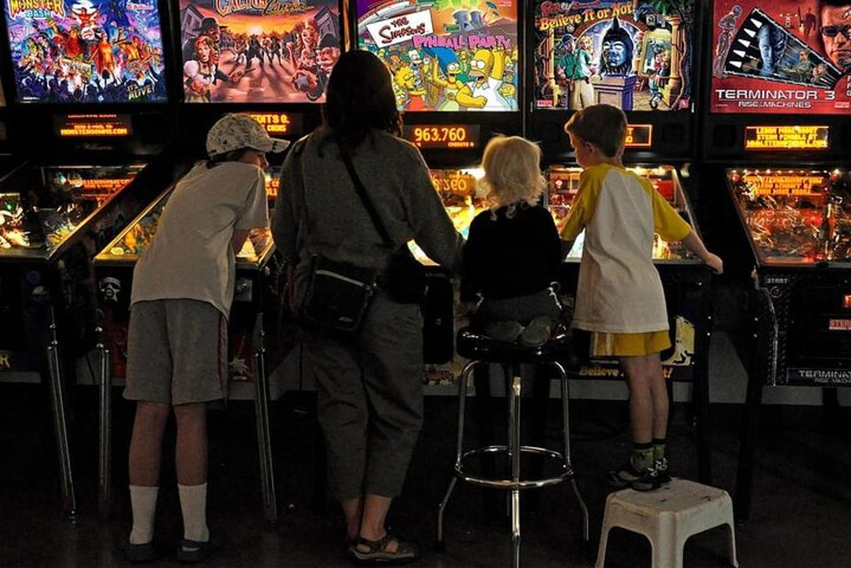 a group of children playing a video game in a casino