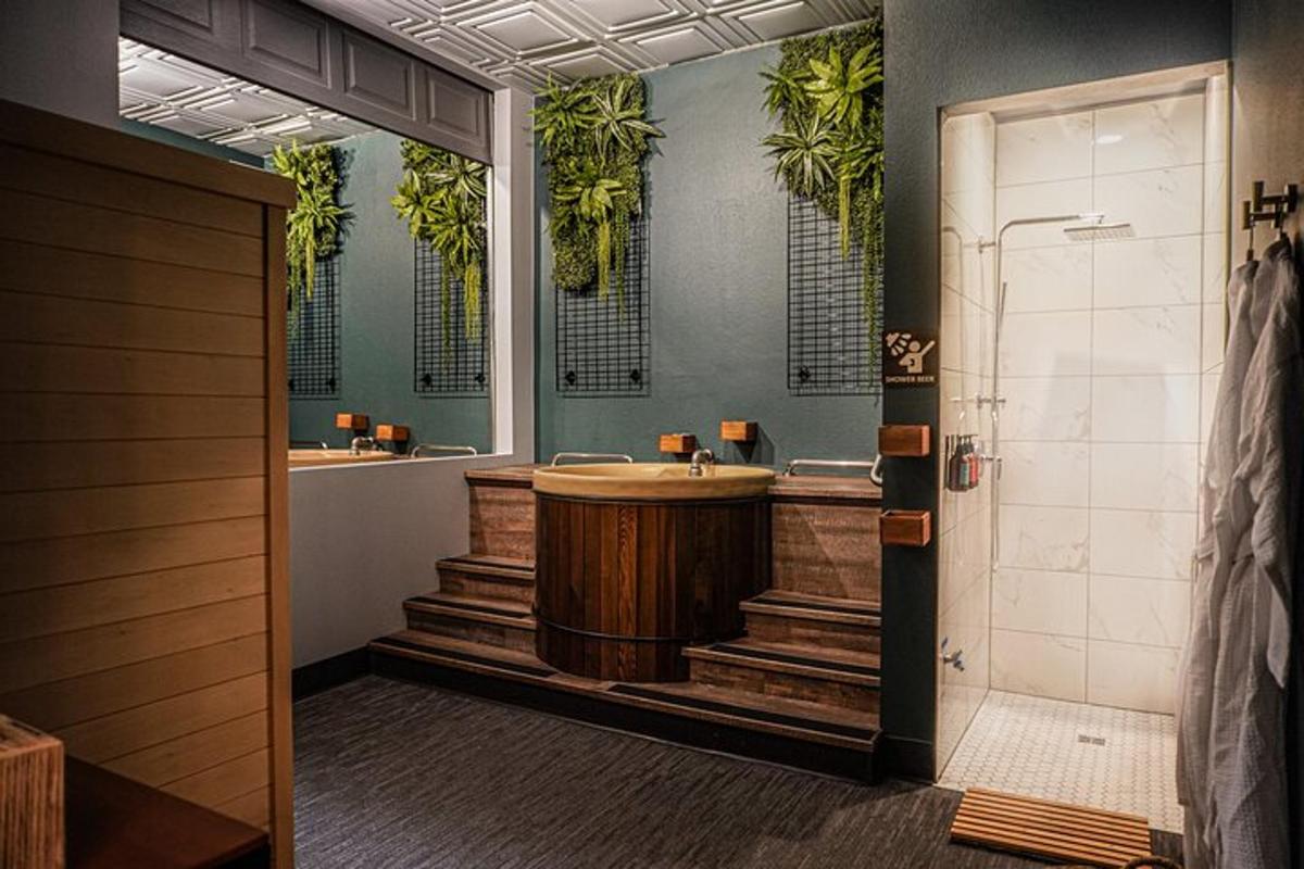 a bathroom with a wooden tub and two sinks