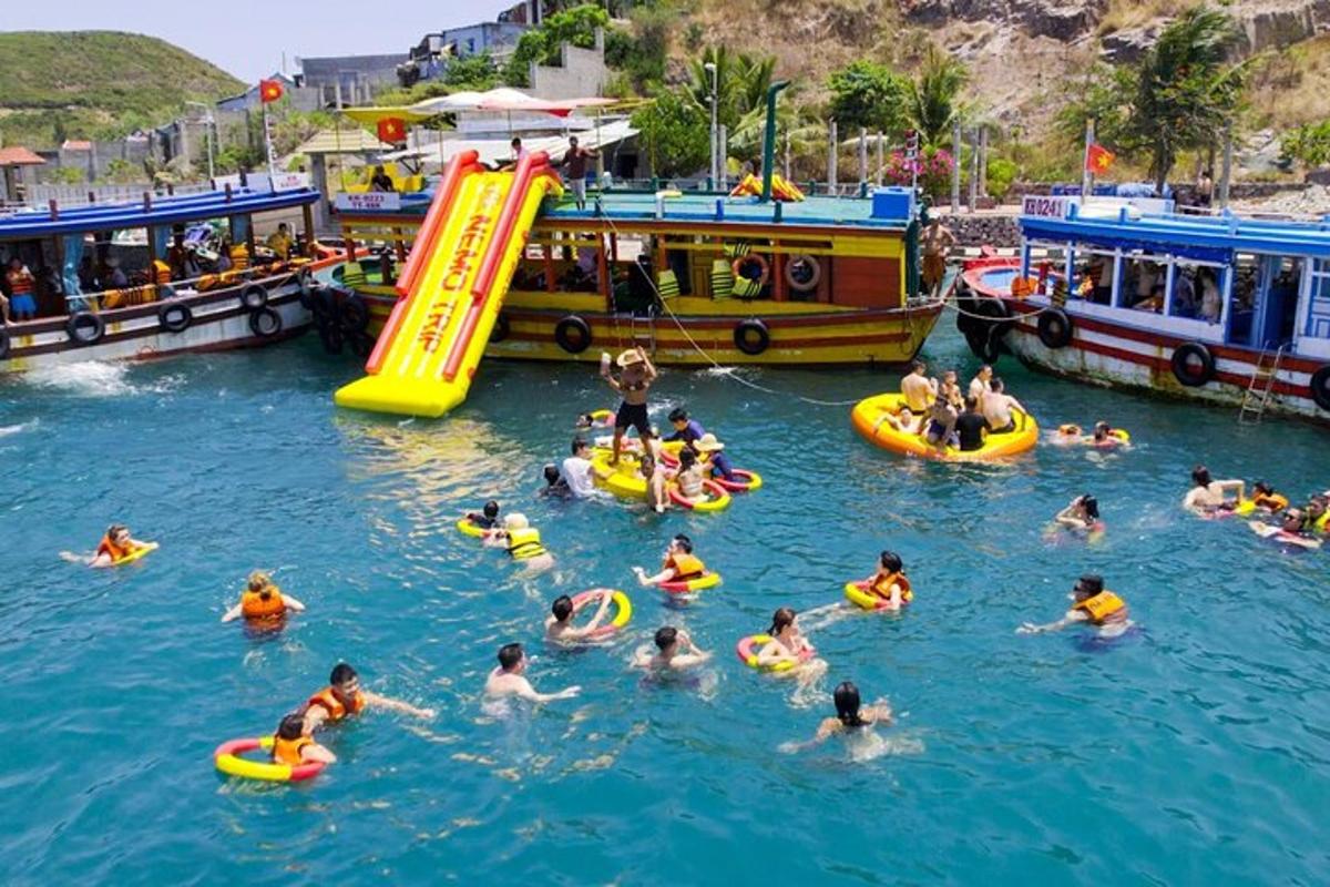 a group of people in the water at a water park