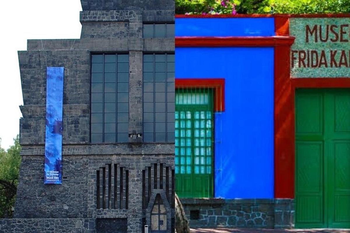 a building with green and blue doors and a fence