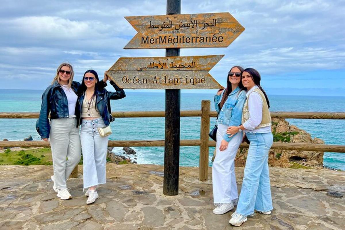 a group of women standing next to a street sign