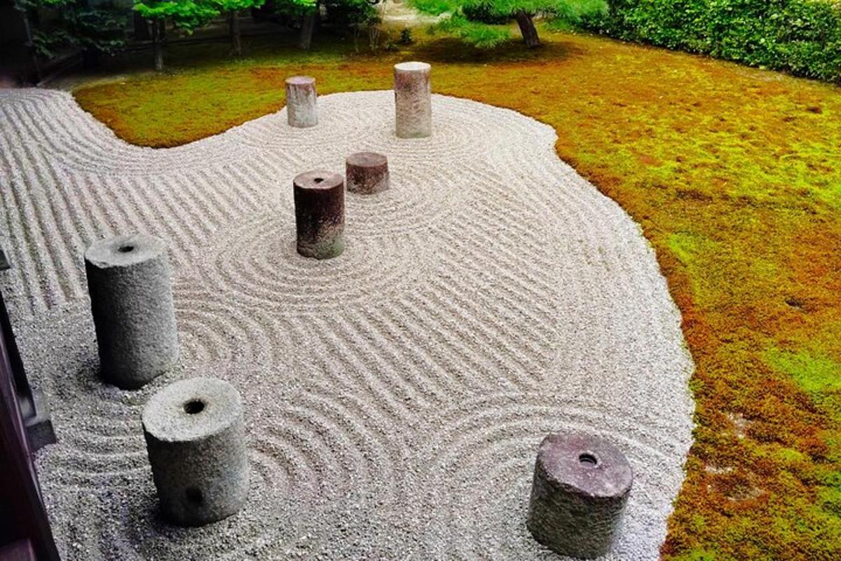 a stone circle with logs in a yard