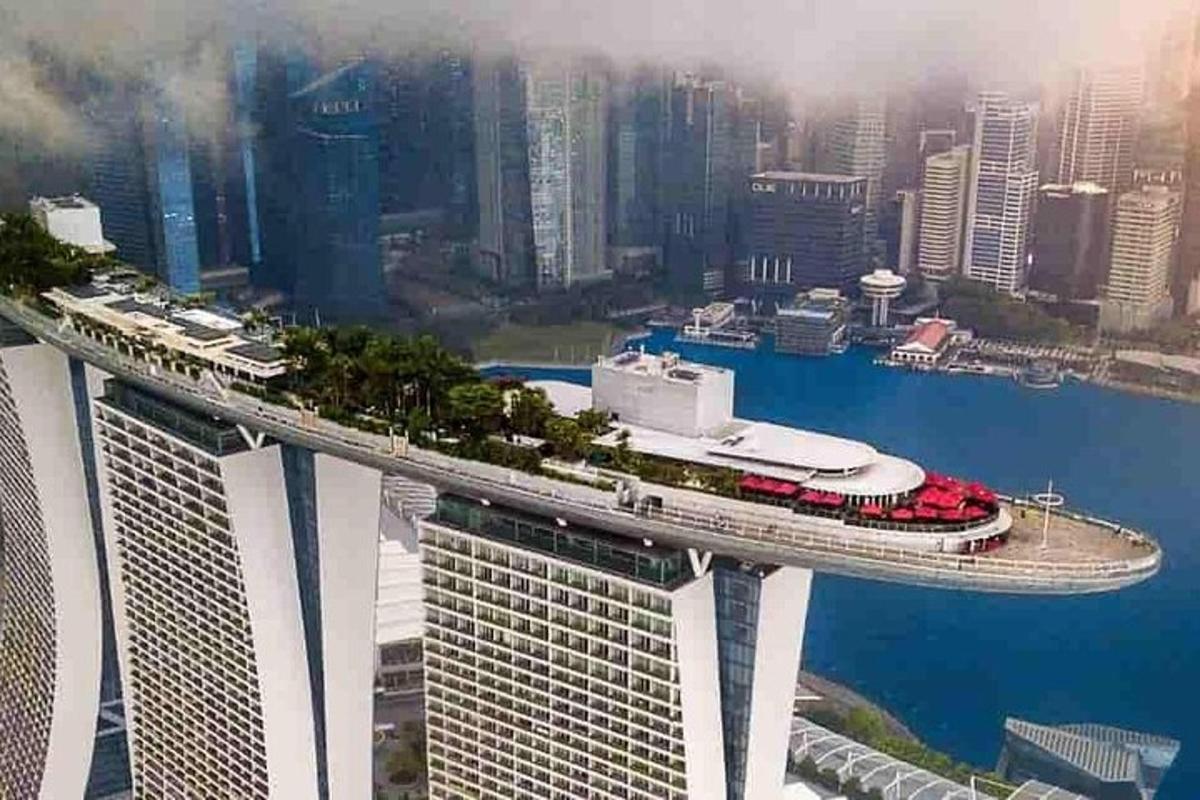 a cruise ship on a bridge in a city