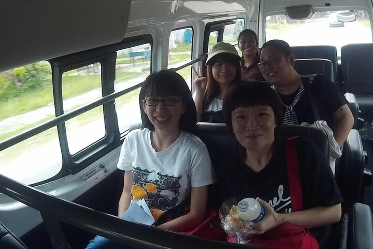 a group of people sitting in a bus