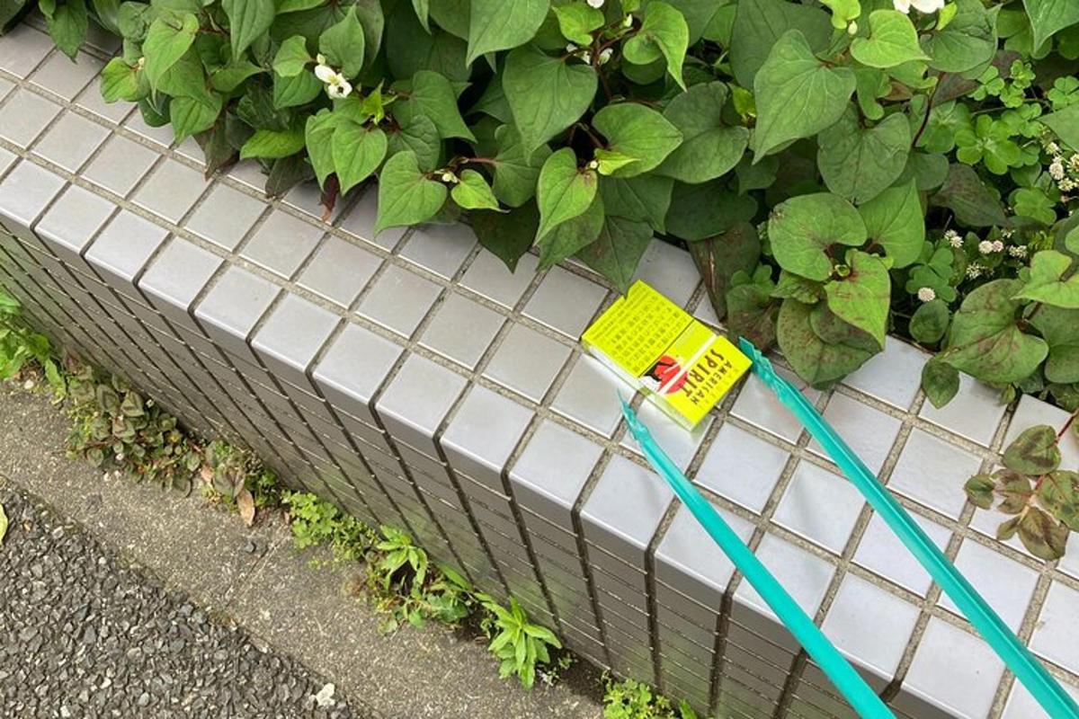 a hose is tied to a planter with plants