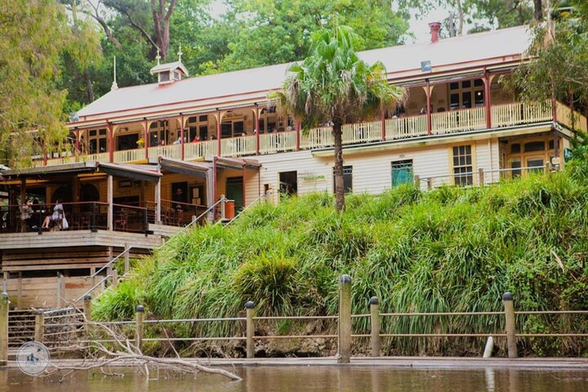 a large building on the side of a river