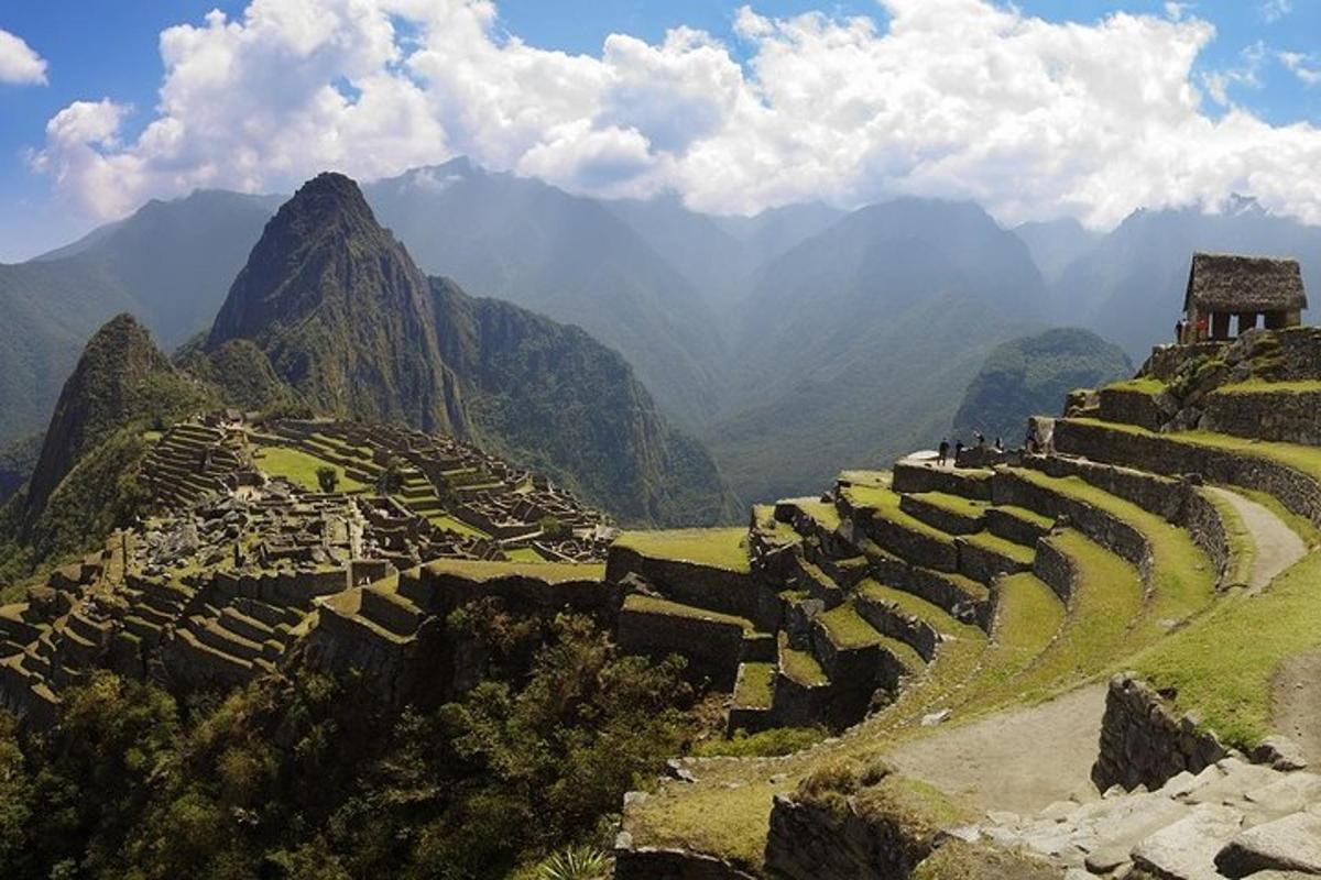 an ancient amphitheater on a mountain with mountains in the background