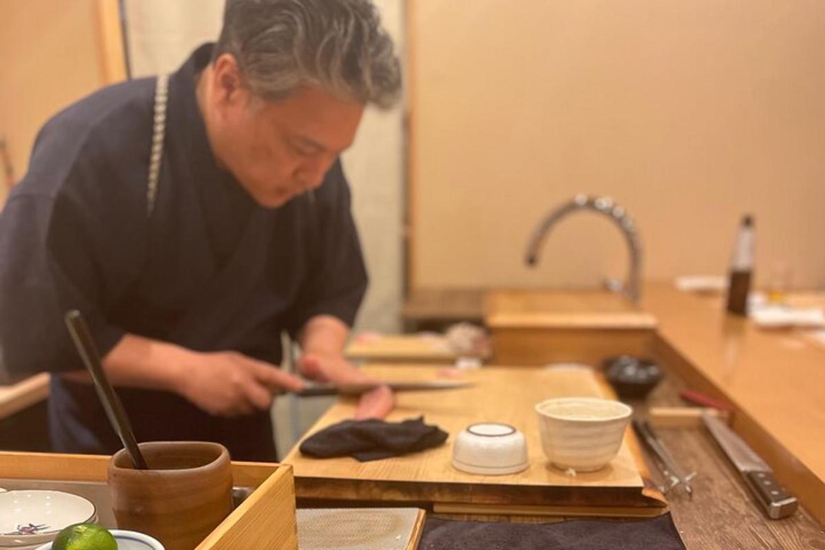a man standing in a kitchen preparing food