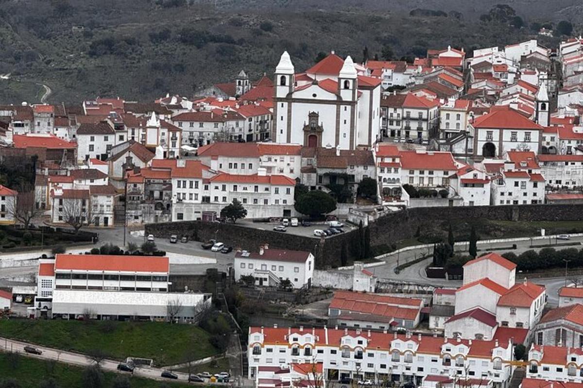 a large city with white buildings and red roofs