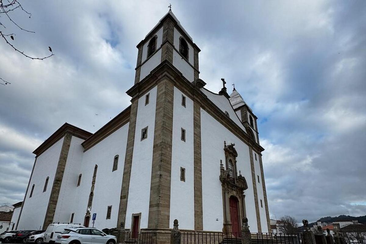 a large white building with a clock tower on it
