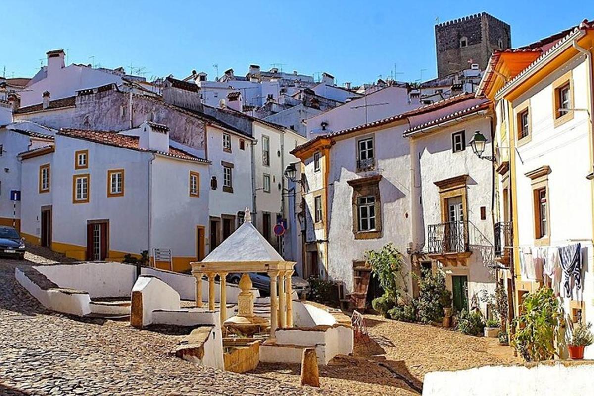 a group of buildings in a town with a street