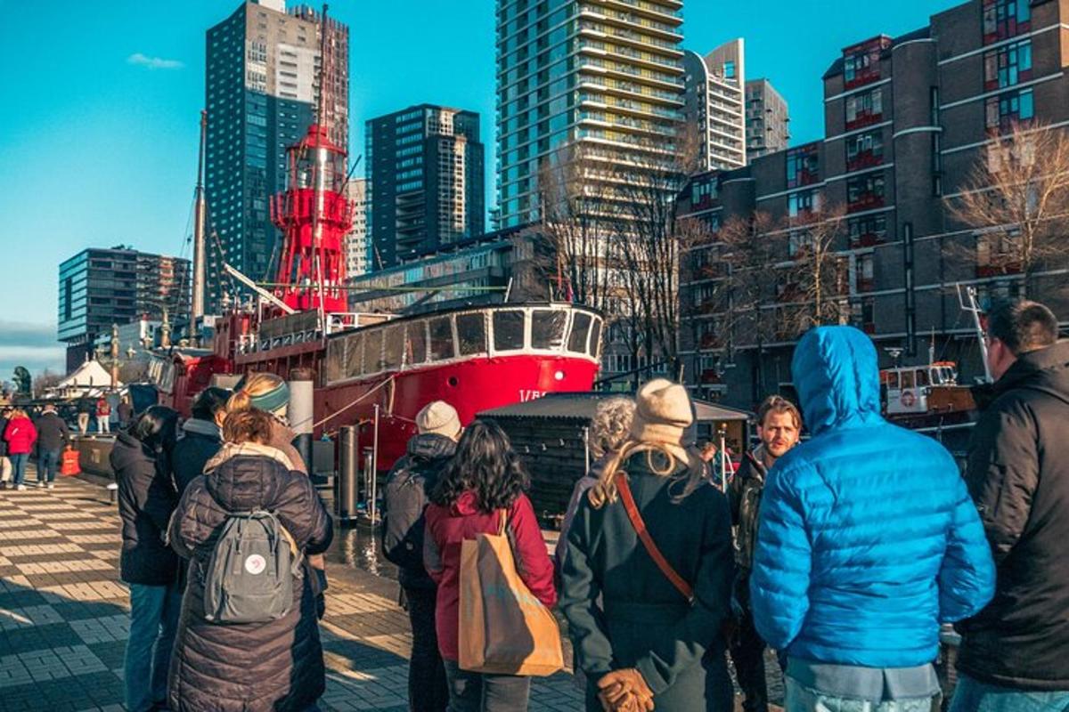 a group of people standing in front of a boat