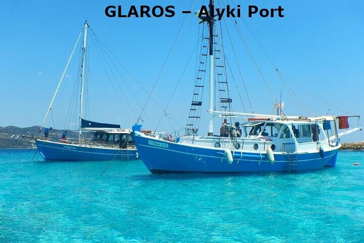 two boats are docked in the blue water