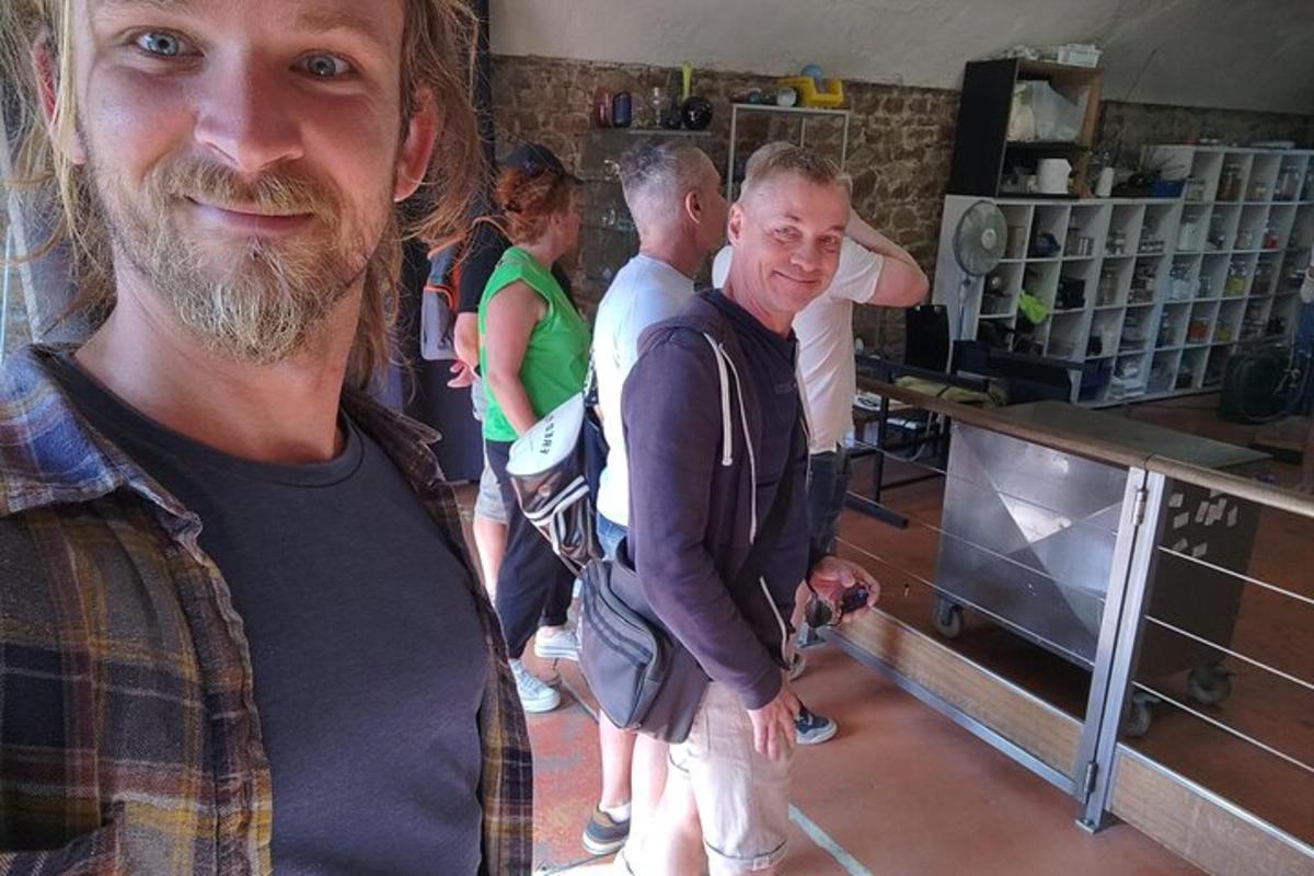 a group of people standing in a kitchen
