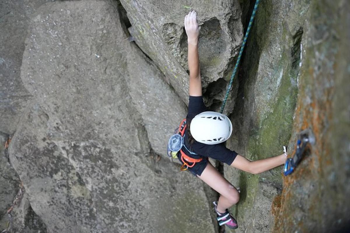 a person is climbing on a rock wall