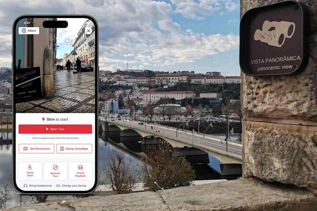a cell phone sitting on a wall next to a bridge