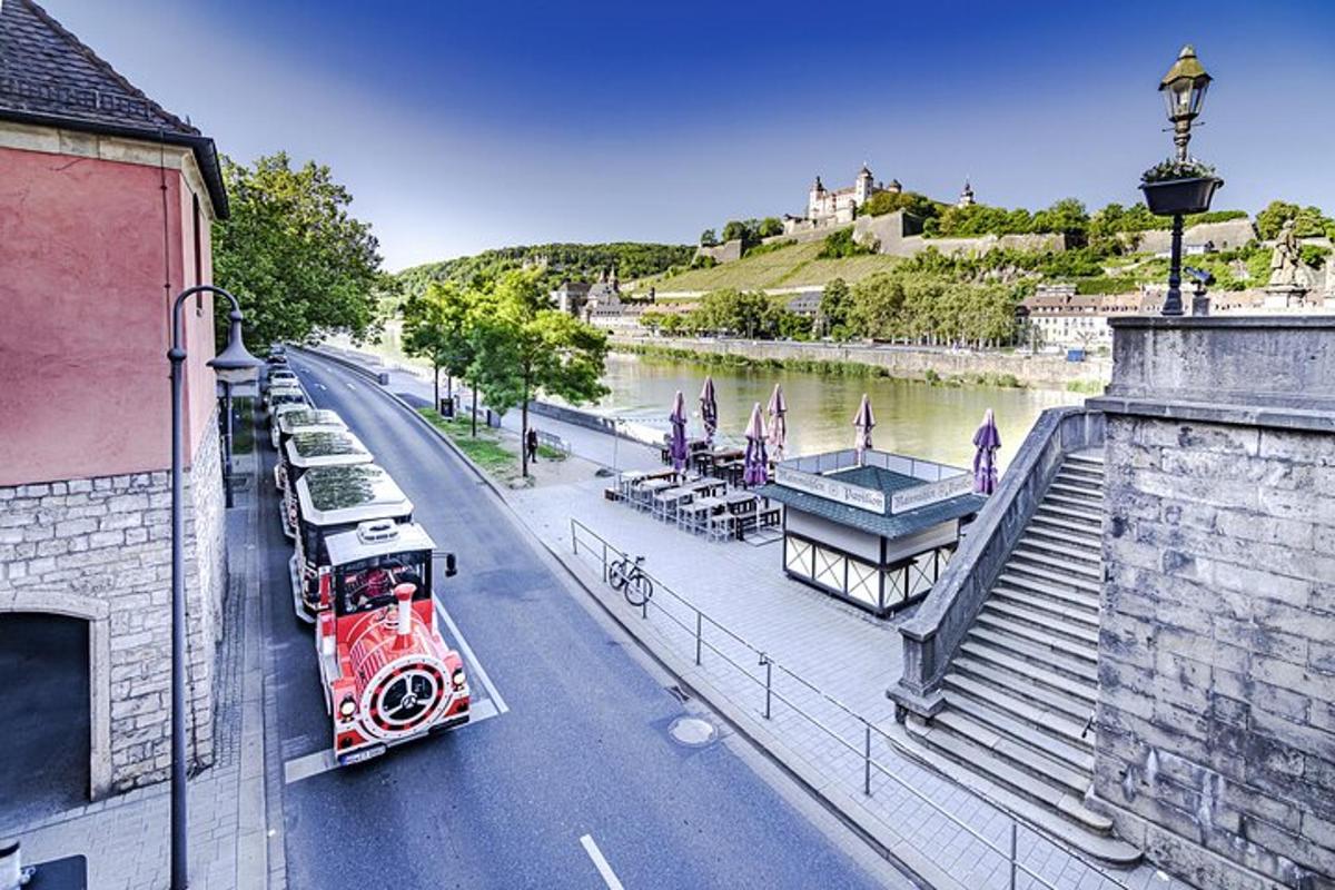 a fire truck driving down a street next to a river