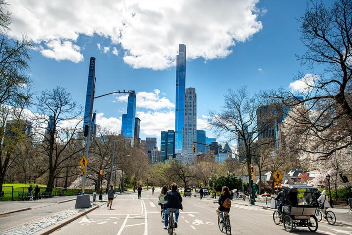 a group of people riding bikes down a city street