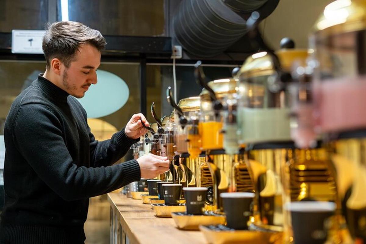 a man standing at a counter in a coffee shop