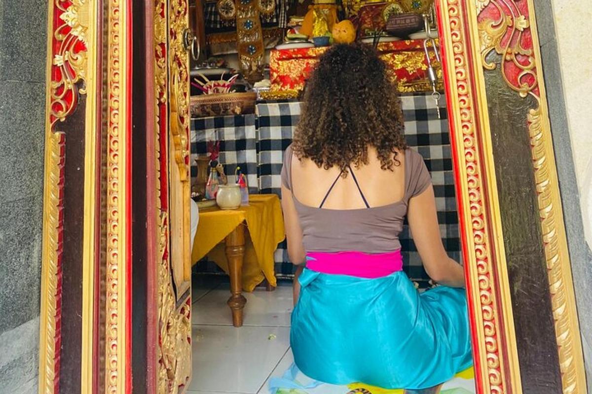 a woman sitting at a table in a mirror