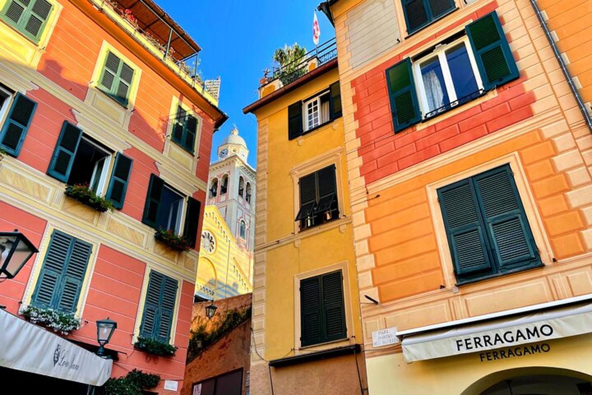 a group of buildings with a clock tower in the background