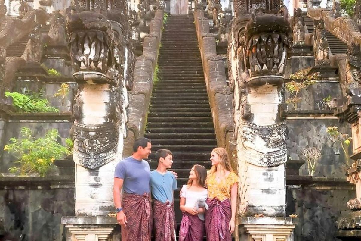 a group of people standing in front of a staircase