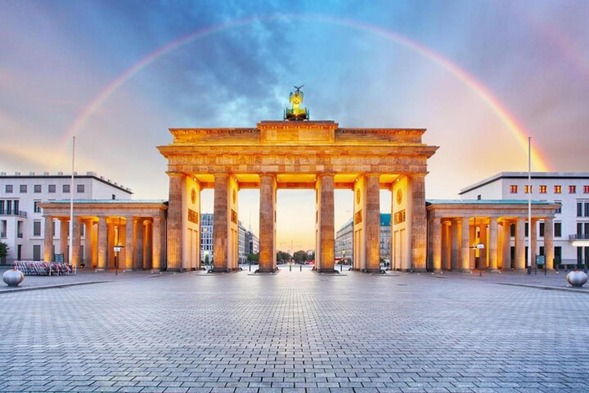 a large building with a rainbow in the background