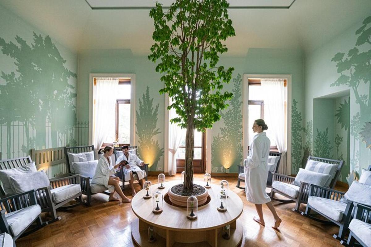 a woman standing in a room with a tree