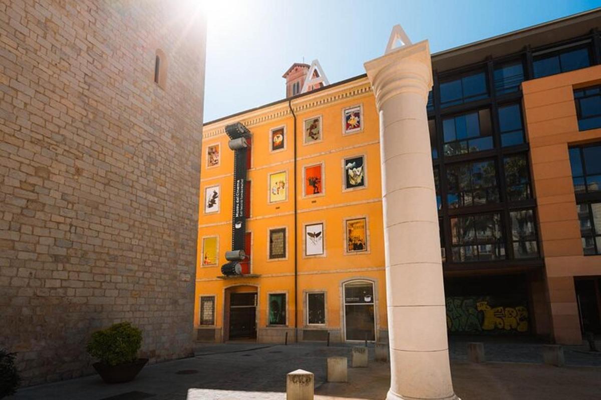 an orange building with a white pillar in front of it