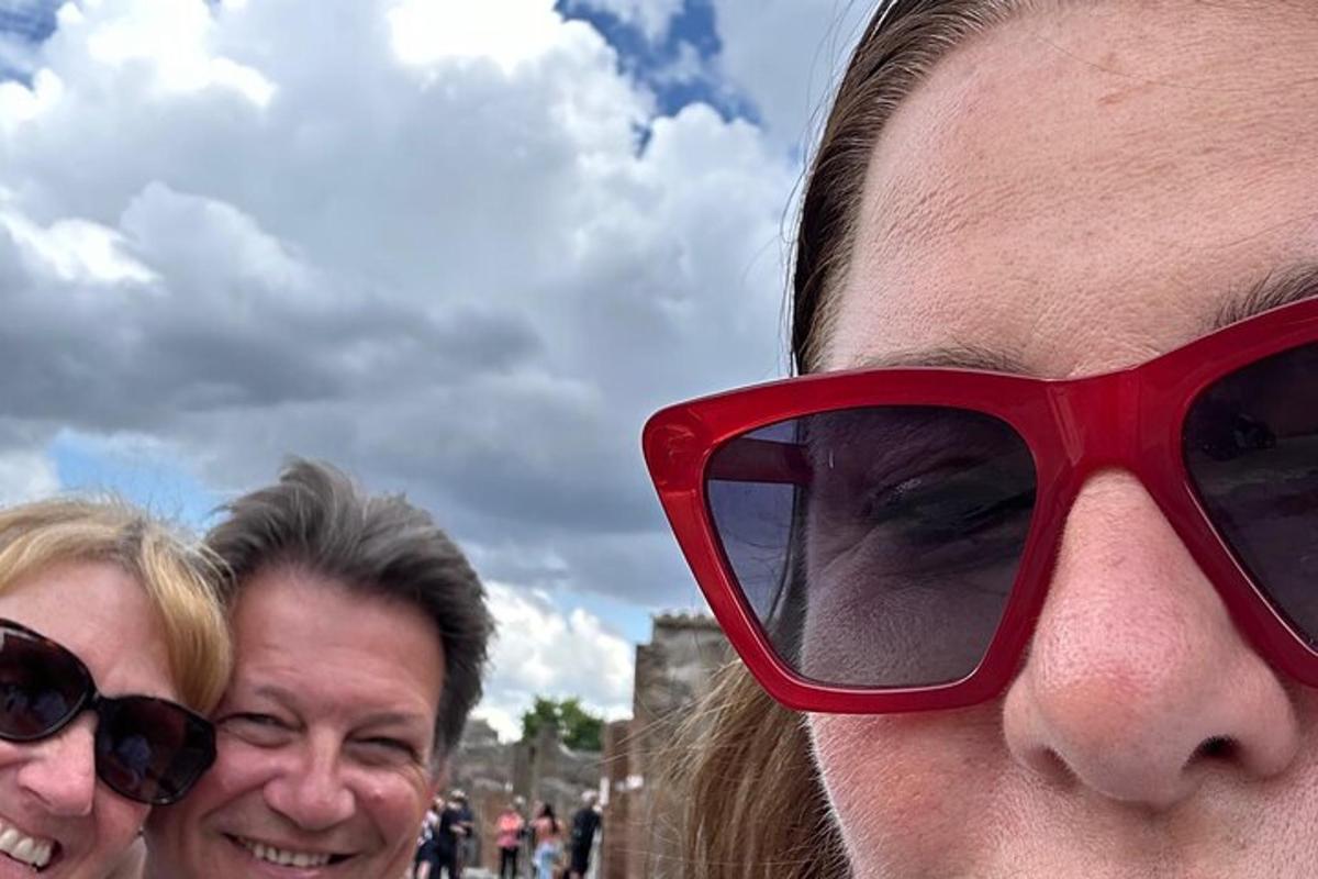 a man with red glasses on his face