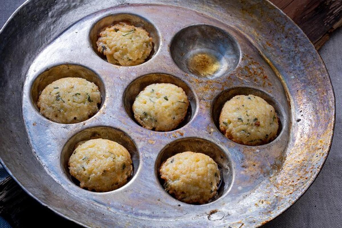 a metal pan with muffins inside