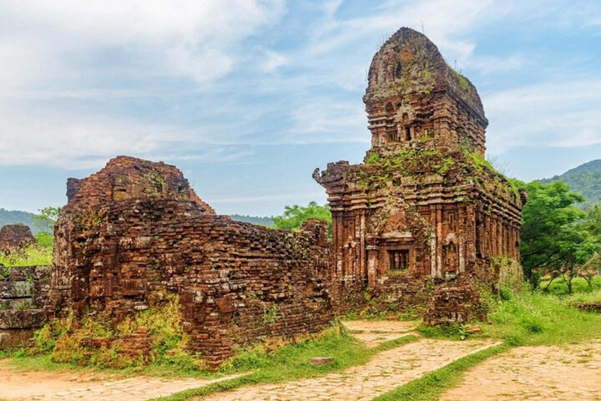 an old stone building on a dirt road